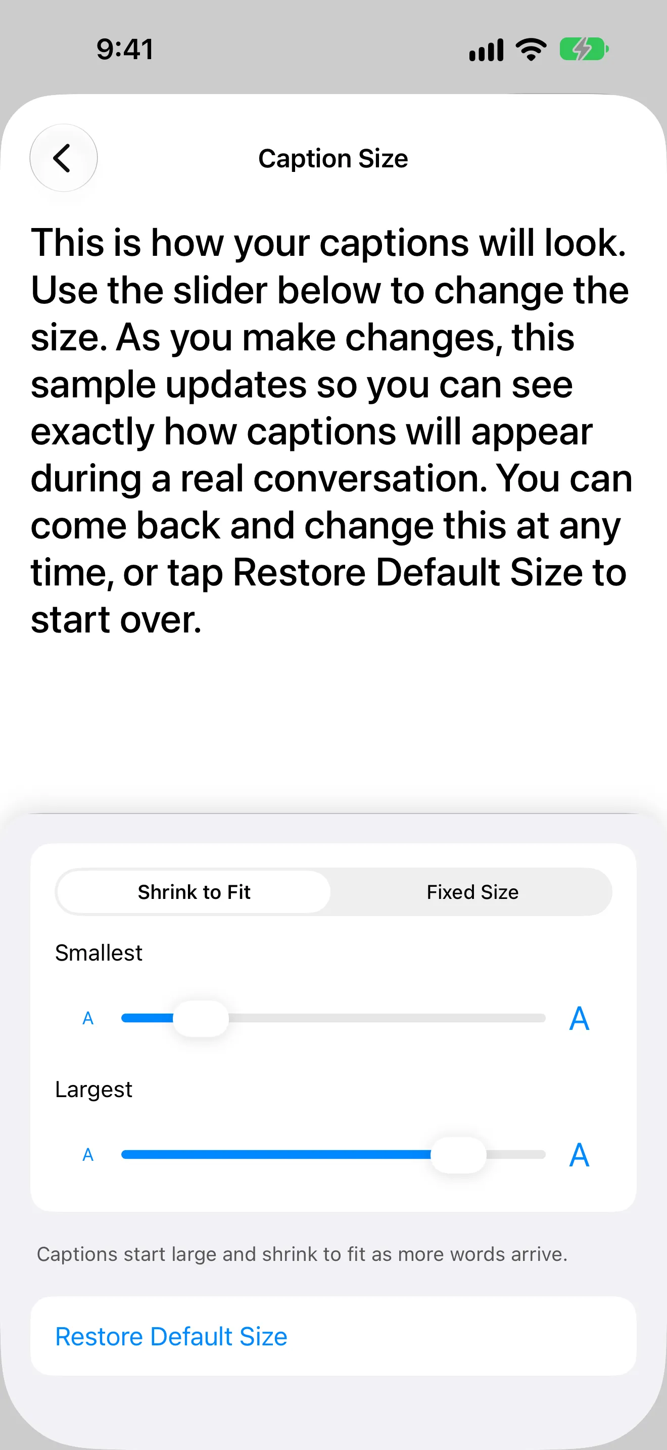 The Caption Size screen in eyeHear 1.7: a sample paragraph at the chosen size, a Shrink to Fit and Fixed Size switch, Smallest and Largest sliders, and Restore Default Size.